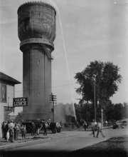 Fire hose being tested near Van's Lunch ca. 1927